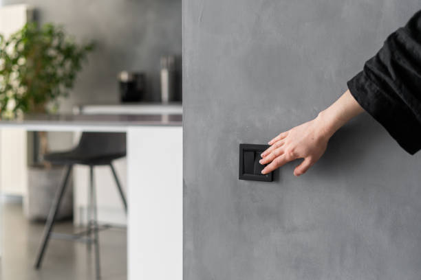 a person closing a switch
