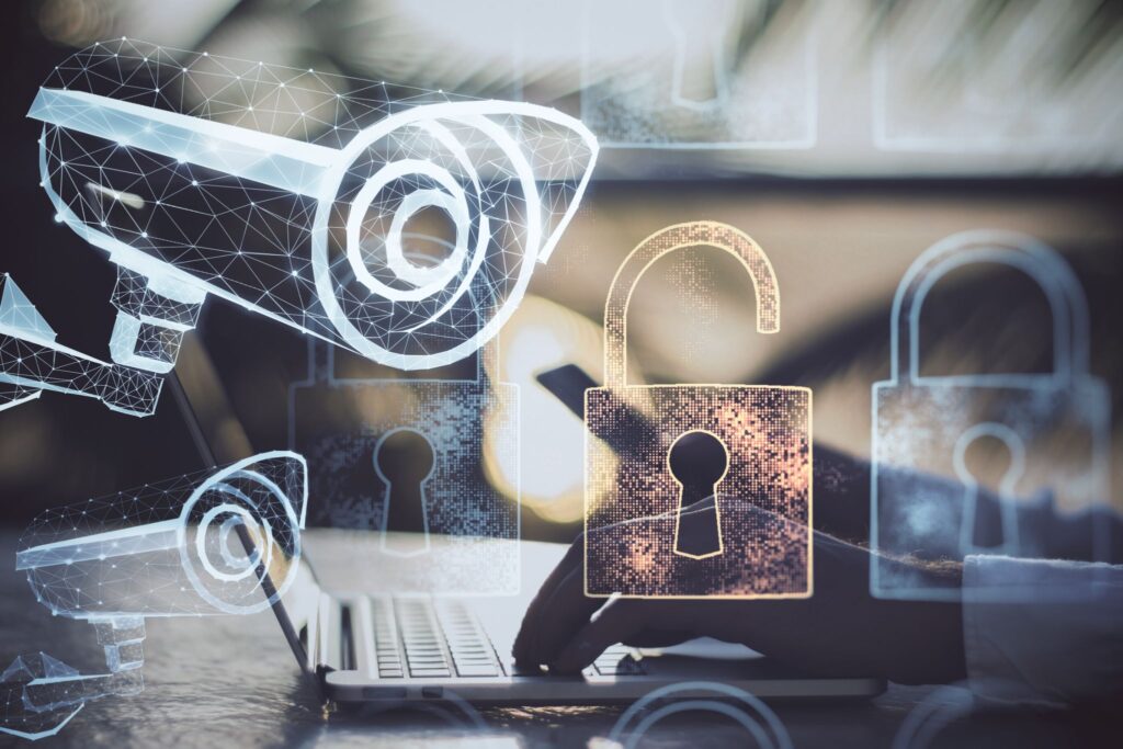 keep-your-automations-working-the-way-you-intended digital overlay of security locks and surveillance cameras over a person using a laptop, representing data privacy and cybersecurity.