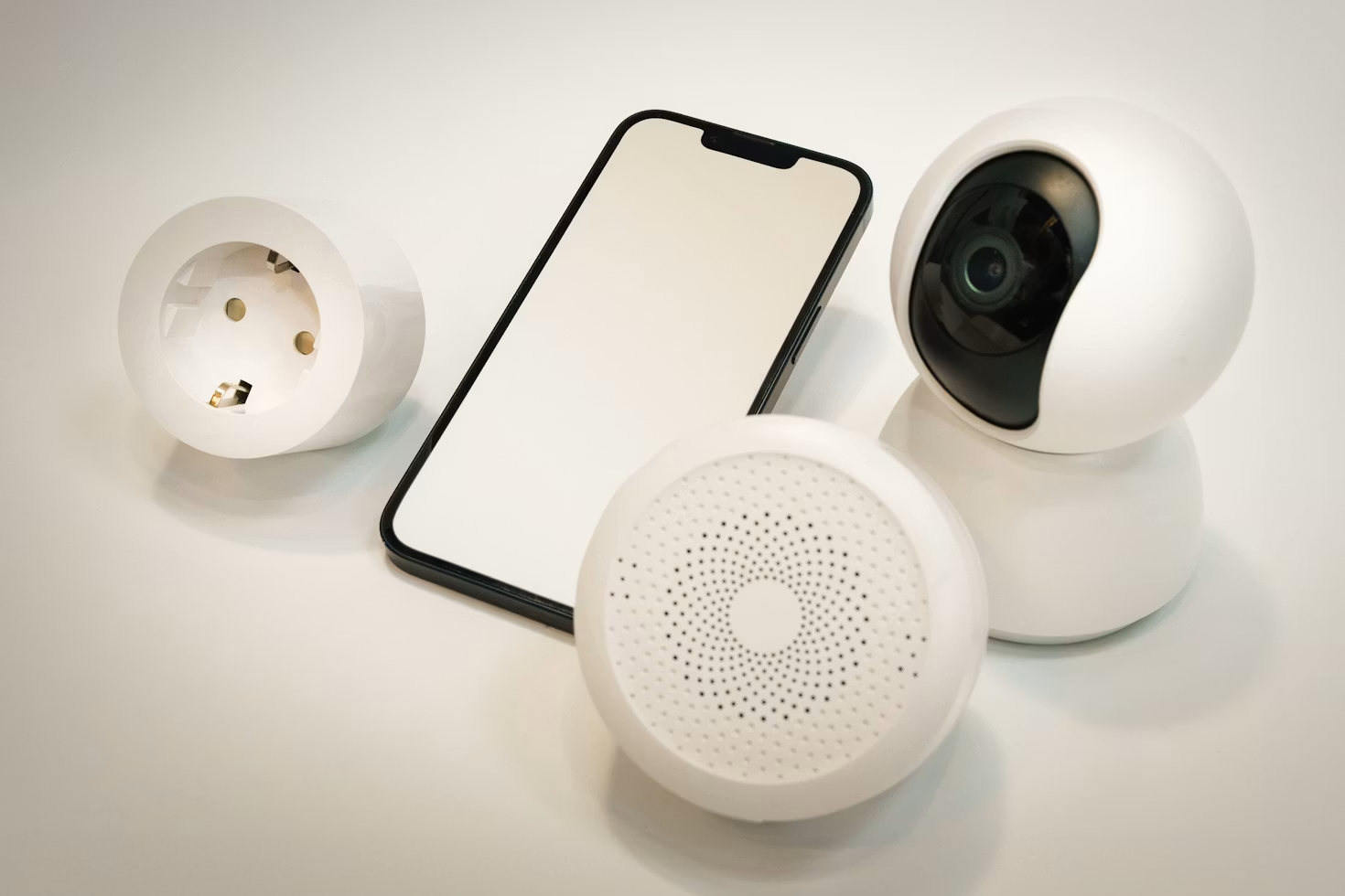 smart home devices including a smart plug, smart speaker, security camera and smartphone