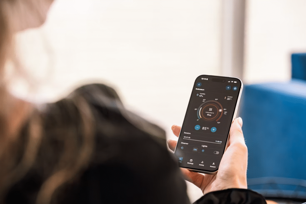 a woman holding a phone with a smart control displayed on her screen